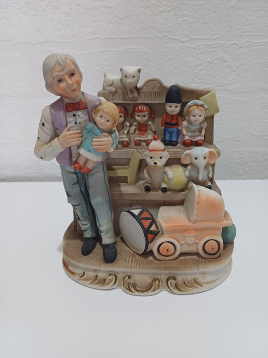 Vintage Style Ceramic Figurine Toy Shop Scene Hand Painted 6.5" High - Very Good Condition