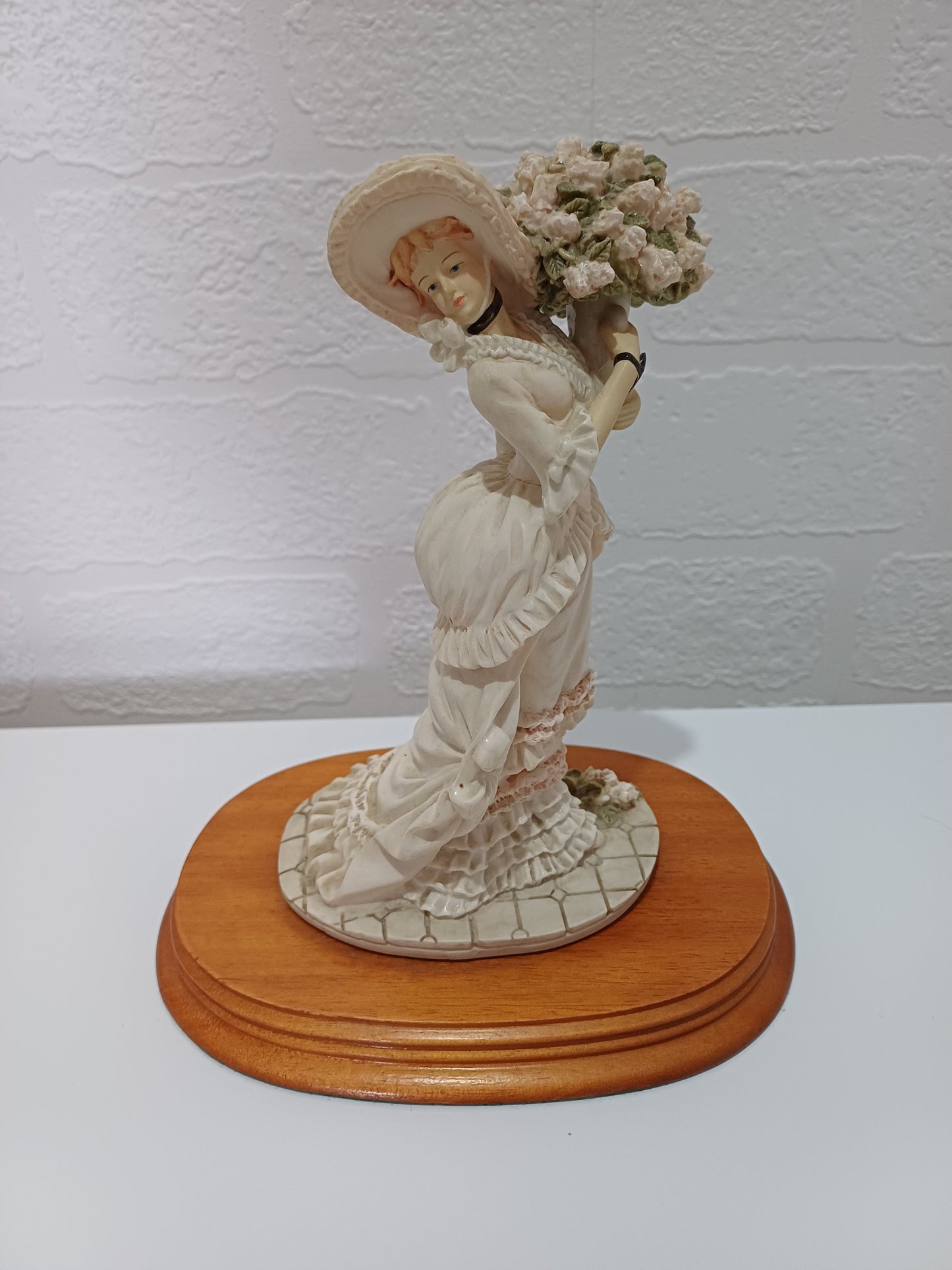 The Leonardo Collection Charlotte Figurine Victorian Lady with Vase of Flowers on Wooden Plinth Dated 1991 Approx. 20cm H x 10cm W (with Plinth) - Good Vintage Condition