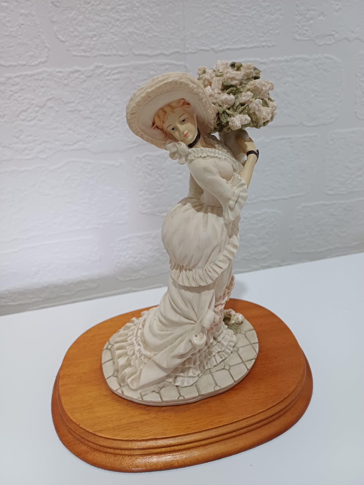 The Leonardo Collection Charlotte Figurine Victorian Lady with Vase of Flowers on Wooden Plinth Dated 1991 Approx. 20cm H x 10cm W (with Plinth) - Good Vintage Condition