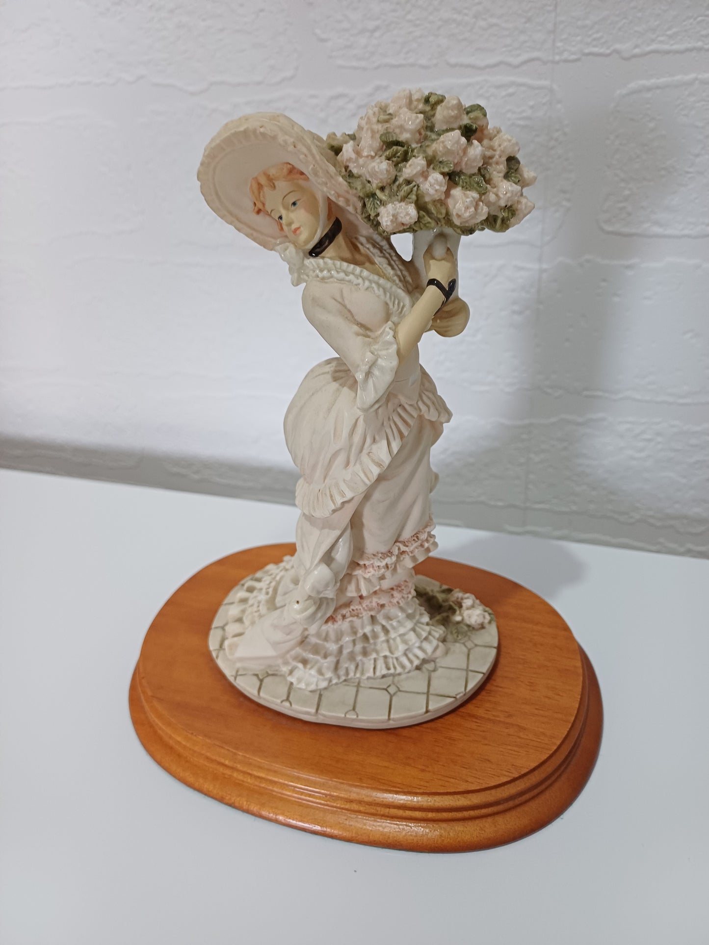 The Leonardo Collection Charlotte Figurine Victorian Lady with Vase of Flowers on Wooden Plinth Dated 1991 Approx. 20cm H x 10cm W (with Plinth) - Good Vintage Condition