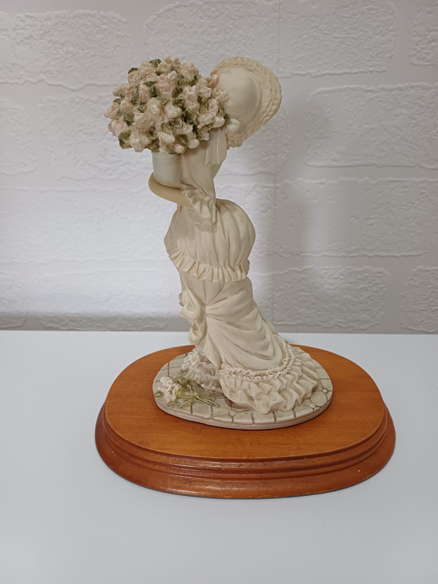The Leonardo Collection Charlotte Figurine Victorian Lady with Vase of Flowers on Wooden Plinth Dated 1991 Approx. 20cm H x 10cm W (with Plinth) - Good Vintage Condition