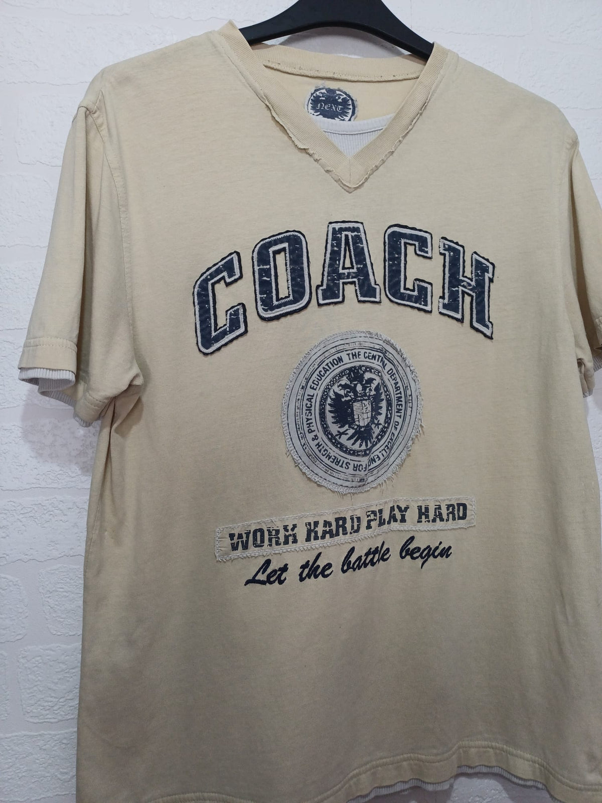 Men's T-Shirt Next Coach Graphic Beige V-Neck Size L Very Good Condition