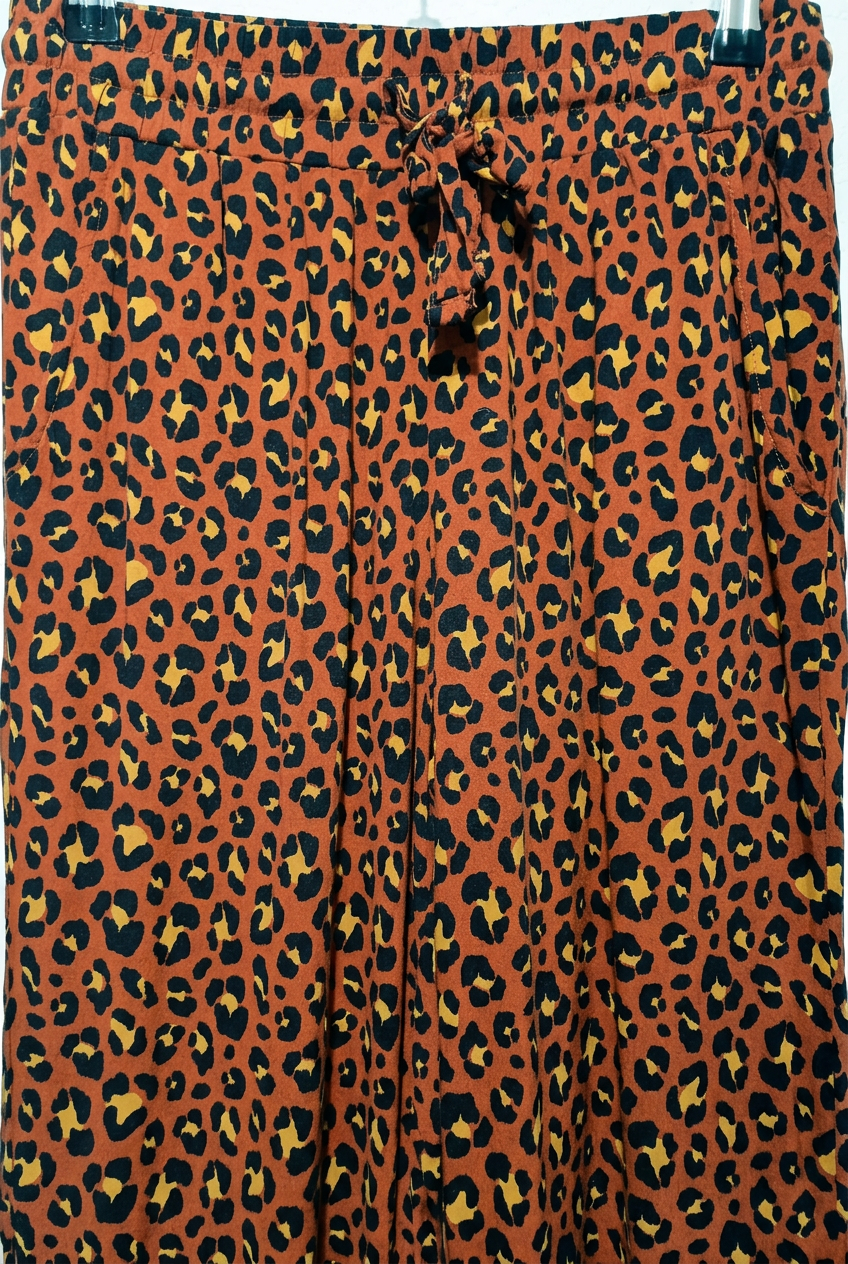 Elasticated drawstring waist on leopard print trousers